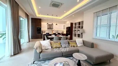 Spacious modern living room with open kitchen and elegant decor