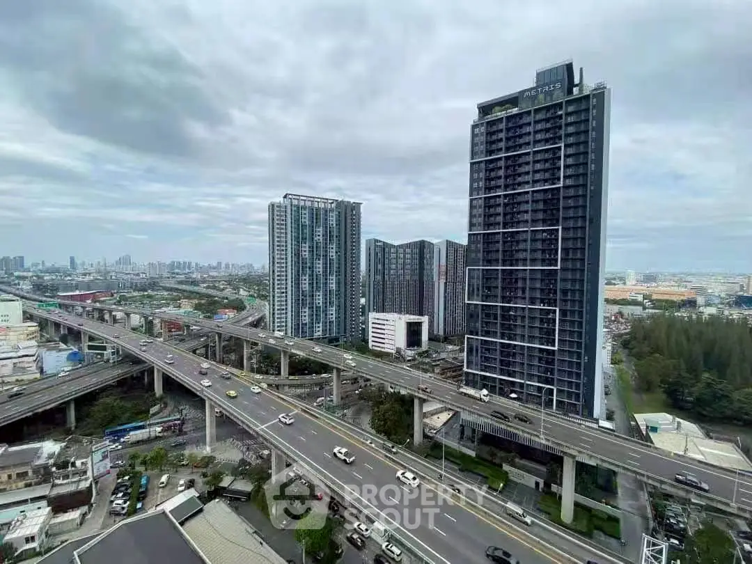 Stunning cityscape view with modern high-rise buildings and highway, perfect for urban living enthusiasts.