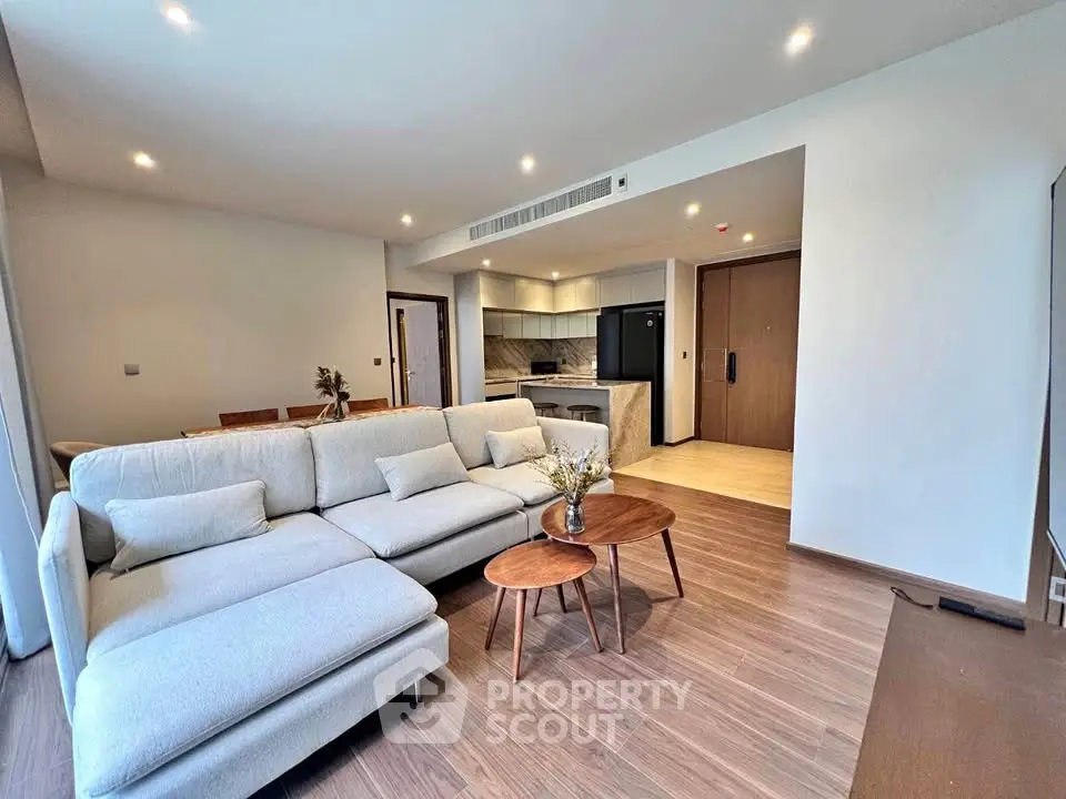 Spacious modern living room with open kitchen and elegant decor