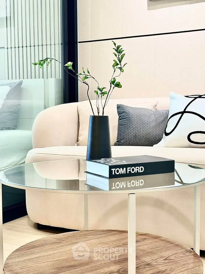 Stylish modern living room with elegant decor and glass coffee table