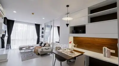 Modern open-plan living room with dining area and stylish decor