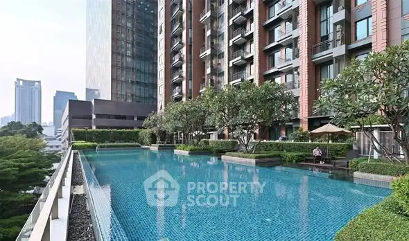 Luxurious high-rise building with stunning rooftop pool and lush greenery, offering breathtaking city views.