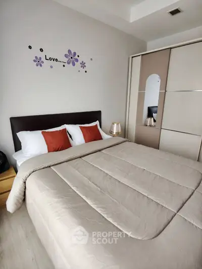 Cozy bedroom with stylish decor and ample storage space