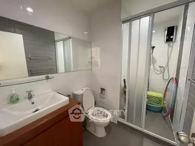 Modern bathroom with glass shower and sleek fixtures