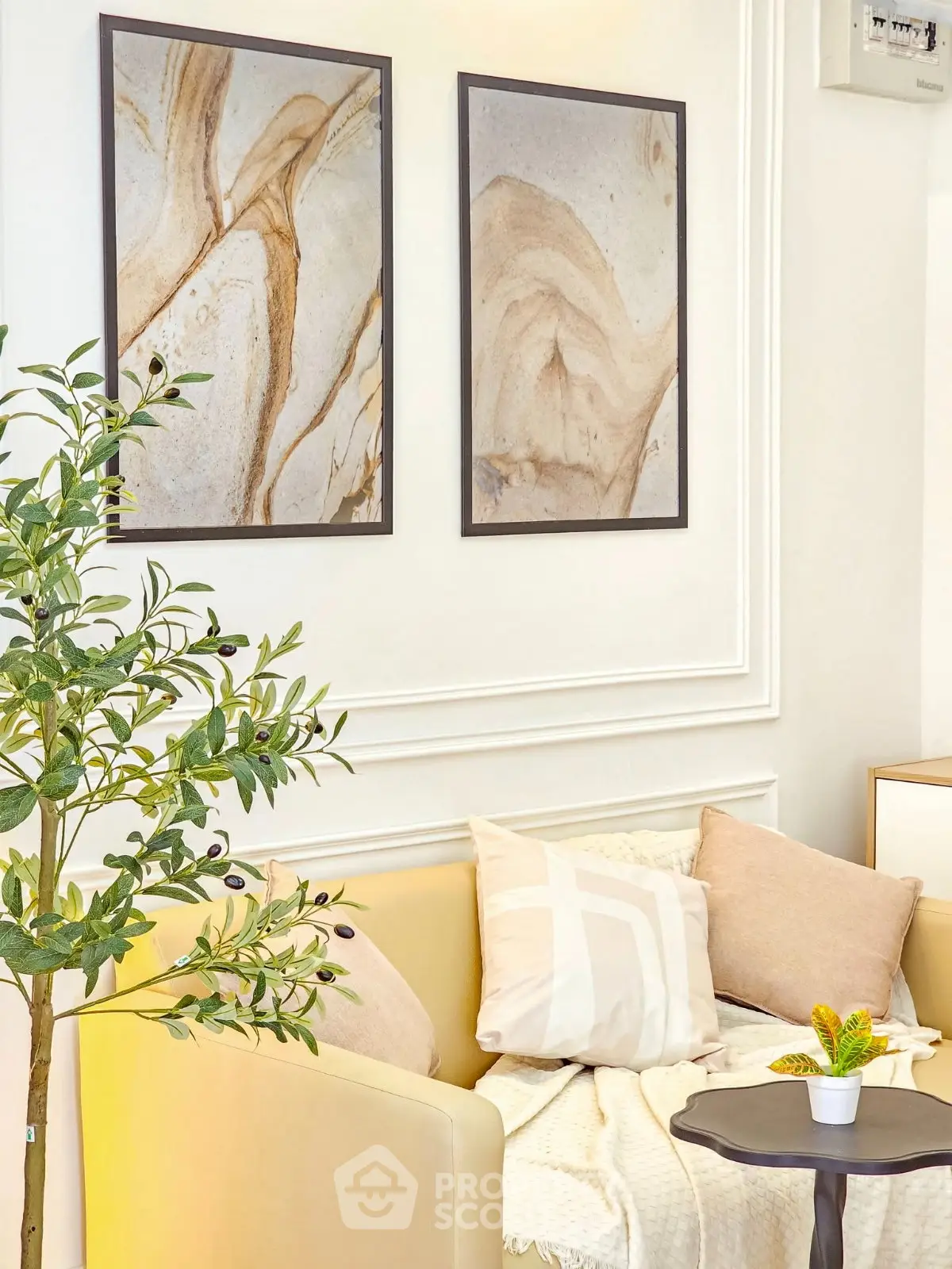 Chic living room with modern art, cozy seating, and elegant decor