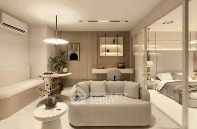 Modern living room with cozy sofa, stylish decor, and open view to bedroom, showcasing elegant interior design.