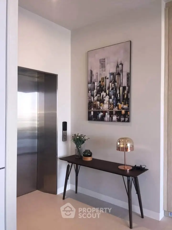 Modern apartment entrance with elevator and stylish decor