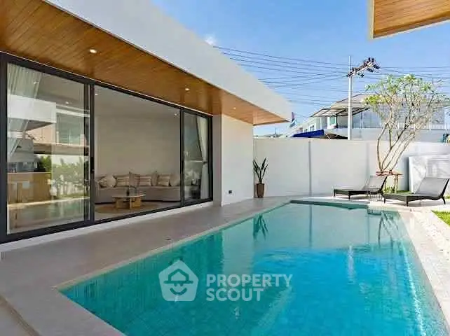 Luxurious modern villa with private pool and spacious patio, perfect for relaxation and entertainment.