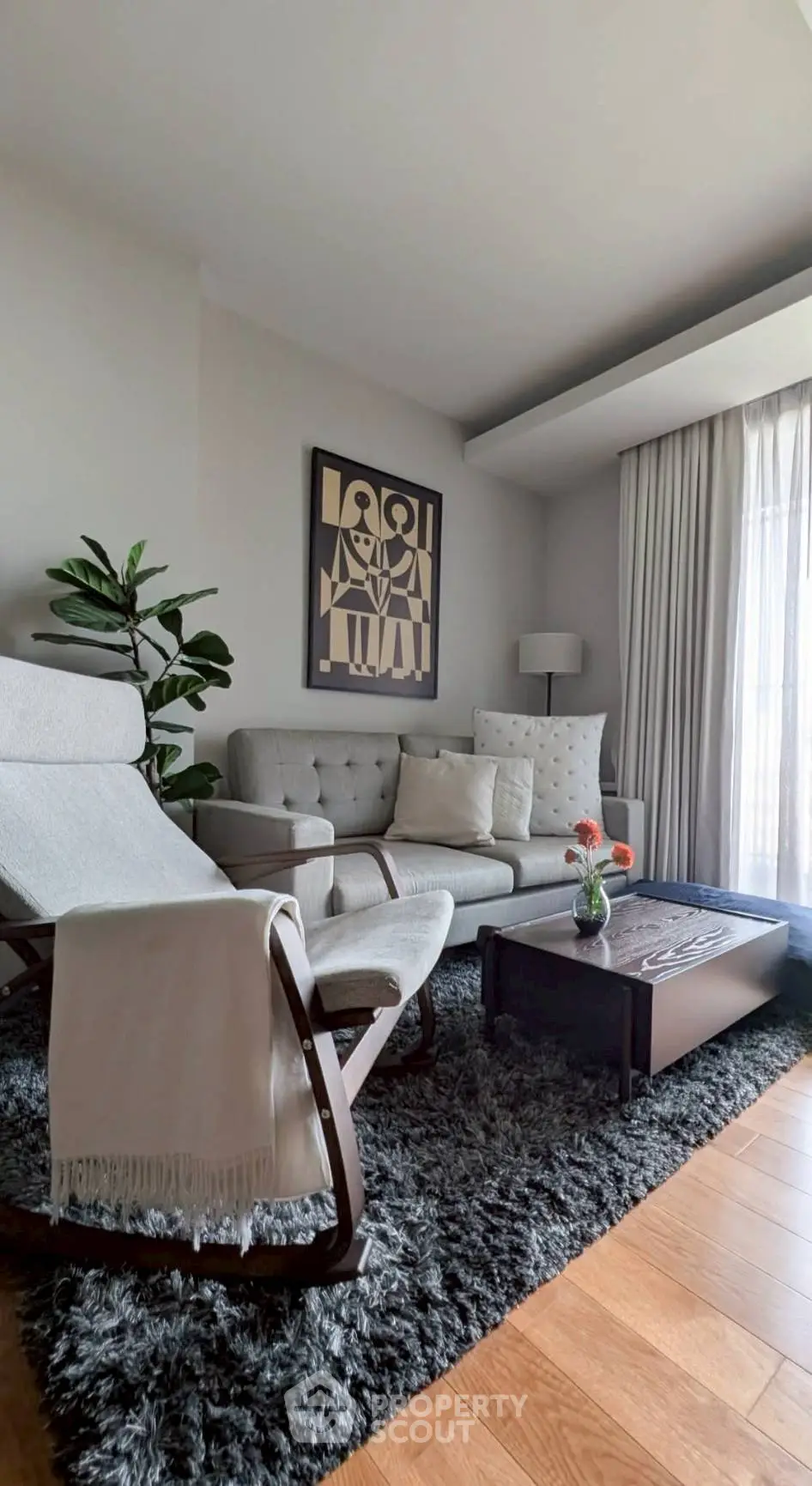 Stylish living room with modern decor and cozy seating area.