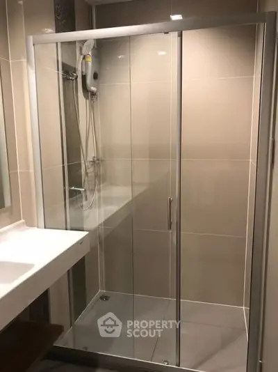 Modern bathroom with glass shower enclosure and sleek design