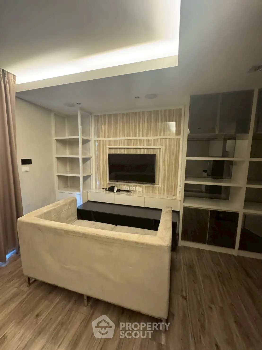 Modern living room with sleek design and wooden flooring