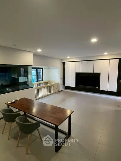 Spacious modern living room with sleek design and ample natural light