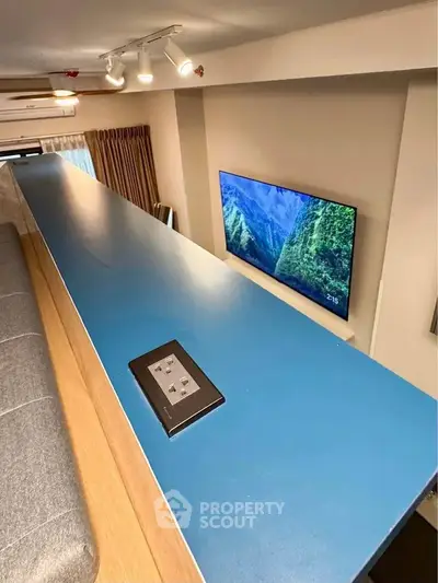 Modern loft-style living room with sleek design and wall-mounted TV