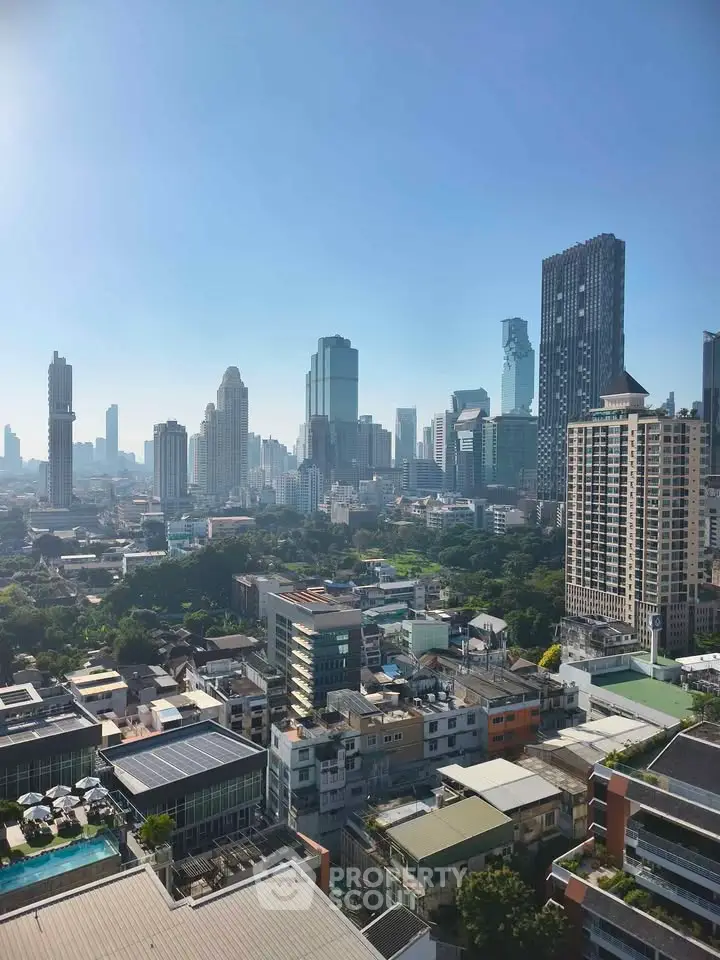 Stunning city skyline view with modern skyscrapers and lush greenery, perfect for urban living.