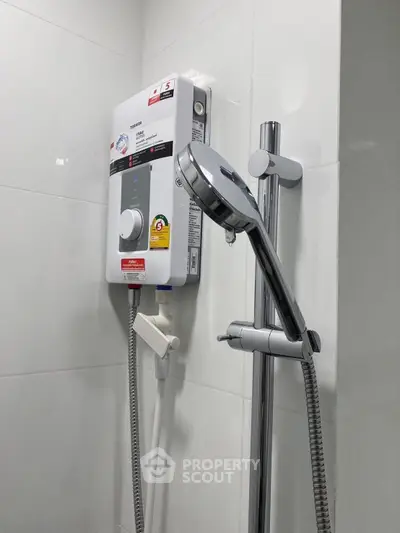 Modern bathroom with sleek showerhead and water heater