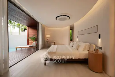 Luxurious bedroom with poolside view and elegant interior design