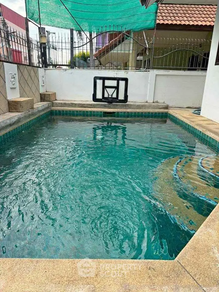 Charming private pool with serene ambiance and modern design, perfect for relaxation and entertainment.