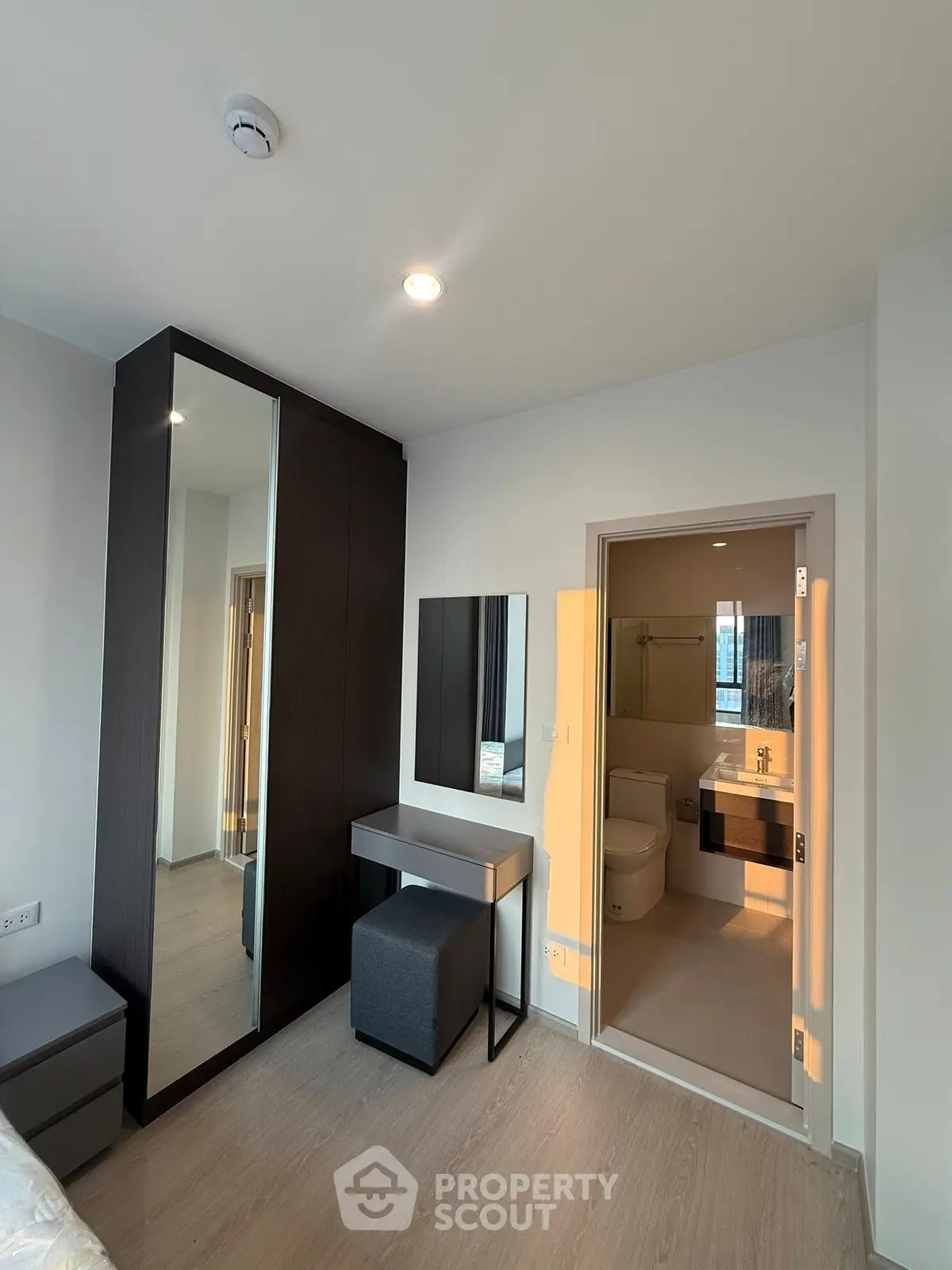 Modern bedroom with ensuite bathroom and sleek furniture design