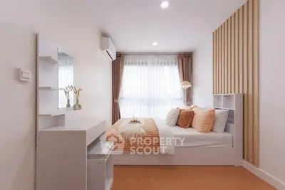 Cozy modern bedroom with stylish decor and natural light