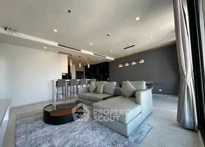 Spacious modern living room with open kitchen and stylish decor