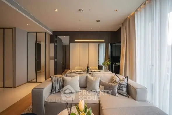 Luxurious modern living room with elegant decor and ample natural light