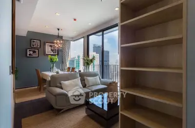 Modern living room with elegant decor and city view balcony