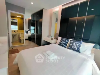 Modern bedroom with ensuite bathroom and stylish decor