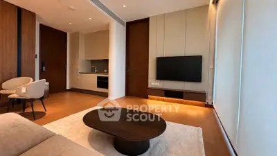 Modern living room with sleek furniture and open kitchen layout