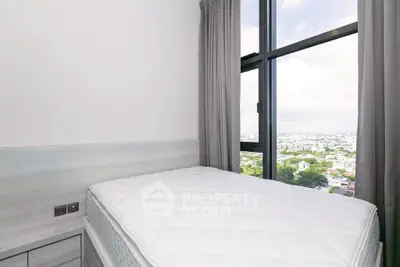 Modern bedroom with large window offering stunning city views, featuring a comfortable bed and elegant decor.