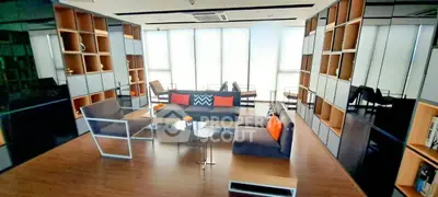 Modern living room with stylish furniture and floor-to-ceiling windows in a contemporary apartment.