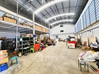 Spacious industrial warehouse with high ceilings and ample storage space.