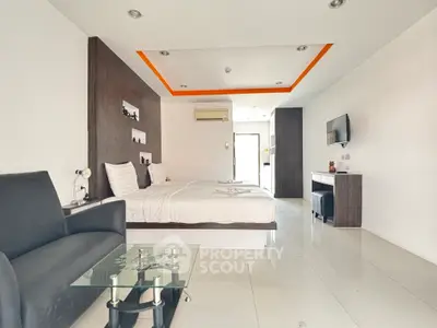 Modern bedroom with sleek design, featuring a cozy bed, stylish furniture, and ambient lighting.