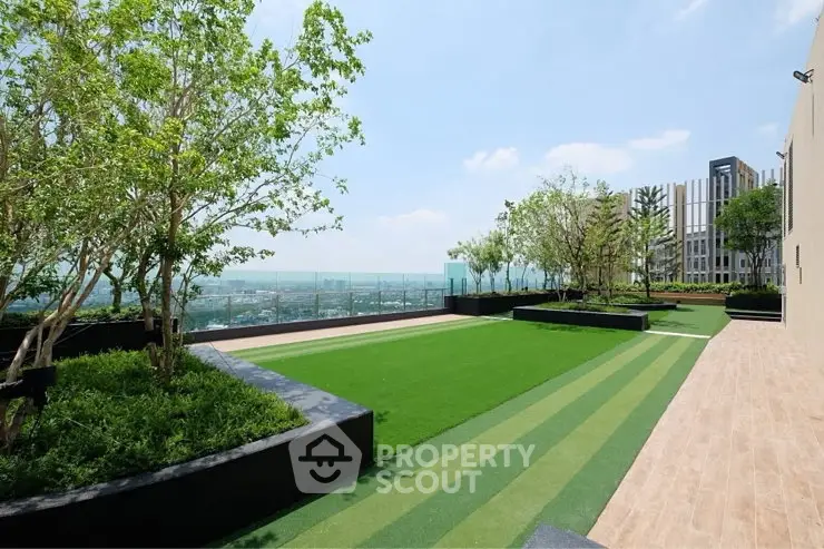 Stunning rooftop garden with panoramic city views and lush greenery.