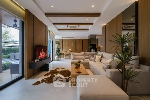 Luxurious modern living room with elegant decor and spacious seating area.