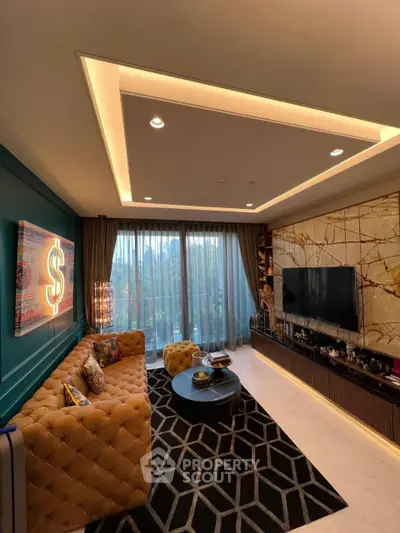 Luxurious living room with modern decor, plush seating, and large windows offering natural light.