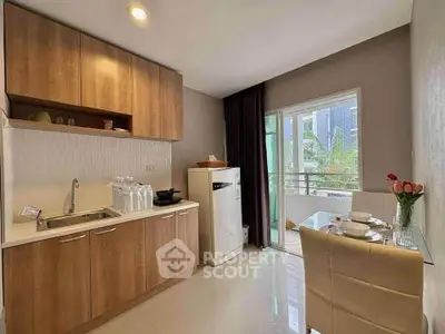 Modern kitchen with wooden cabinets and balcony view in a stylish apartment.
