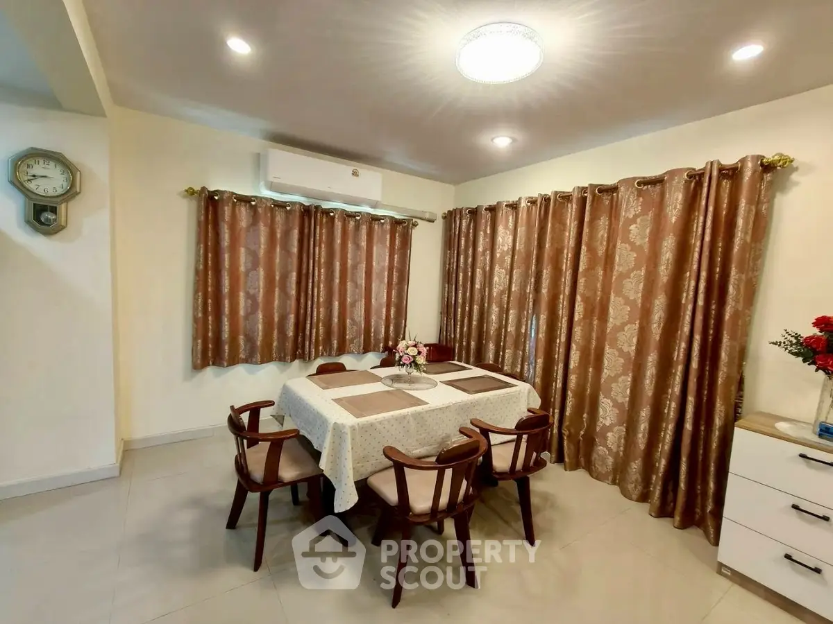 Elegant dining room with stylish table setting and warm lighting, perfect for family gatherings.