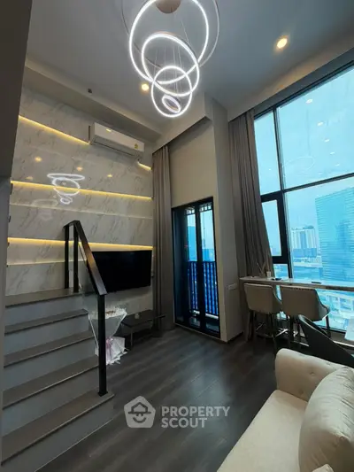 Modern duplex living room with high ceilings and city view