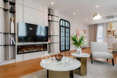 Luxurious modern living room with elegant decor and fireplace, perfect for relaxation.