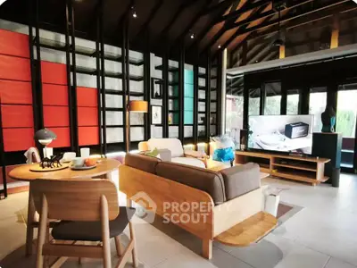 Modern living room with stylish furniture and vibrant wall design, perfect for contemporary living.