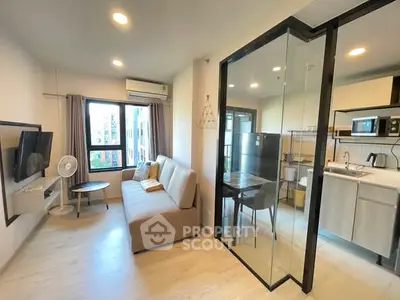 Modern living room with glass partition and cozy kitchen area