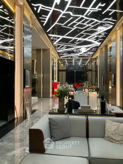 Luxurious modern living room with unique ceiling lighting and elegant decor