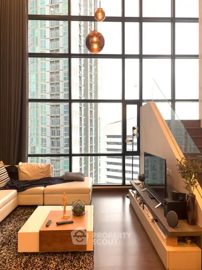 Luxurious modern living room with floor-to-ceiling windows and stunning city view.
