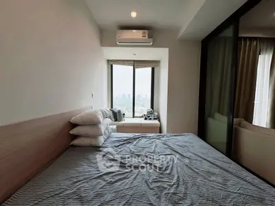 Cozy bedroom with city view and modern air conditioning unit