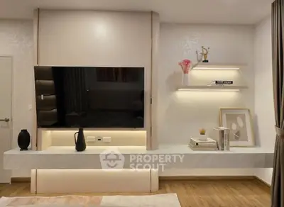 Modern living room with sleek TV unit and ambient lighting