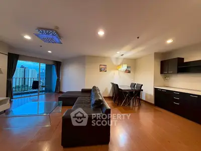 Spacious modern living room with city view and elegant dining area