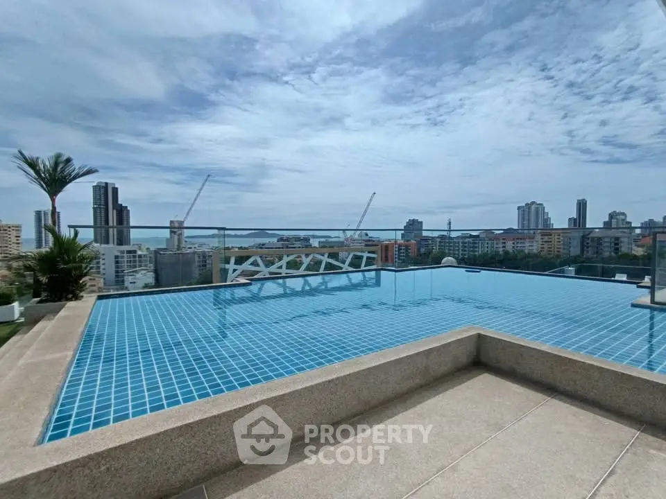 Stunning rooftop infinity pool with panoramic city views and modern design.
