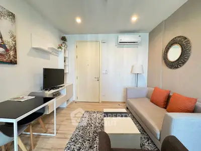 Modern living room with stylish decor, cozy sofa, and wall-mounted TV in a contemporary apartment.