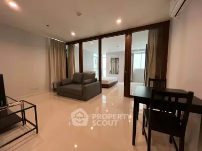 Spacious modern living room with sleek furniture and open layout in a stylish apartment.