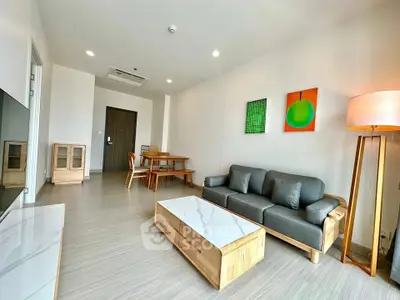 Modern living room with stylish furniture and contemporary decor in a spacious apartment.